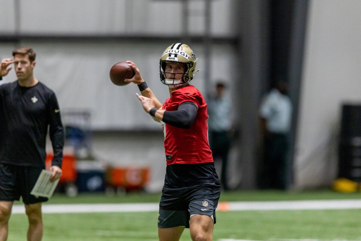 Rookie quarterback practicing reads and passing mechanics