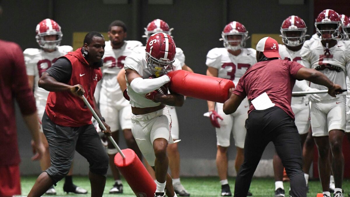 College football transfer player participating in team practice