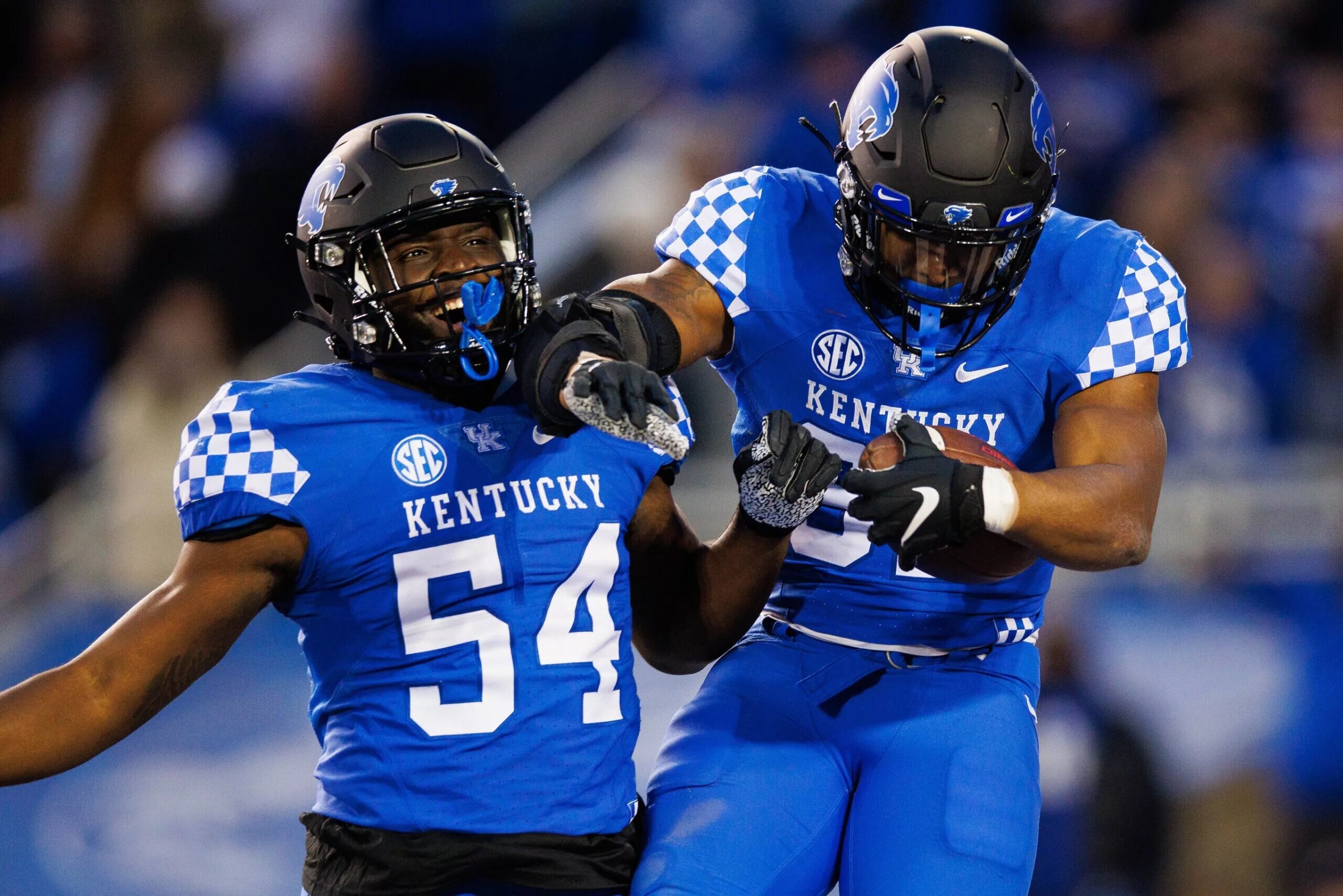 College football hybrid defensive player practicing coverage and run support