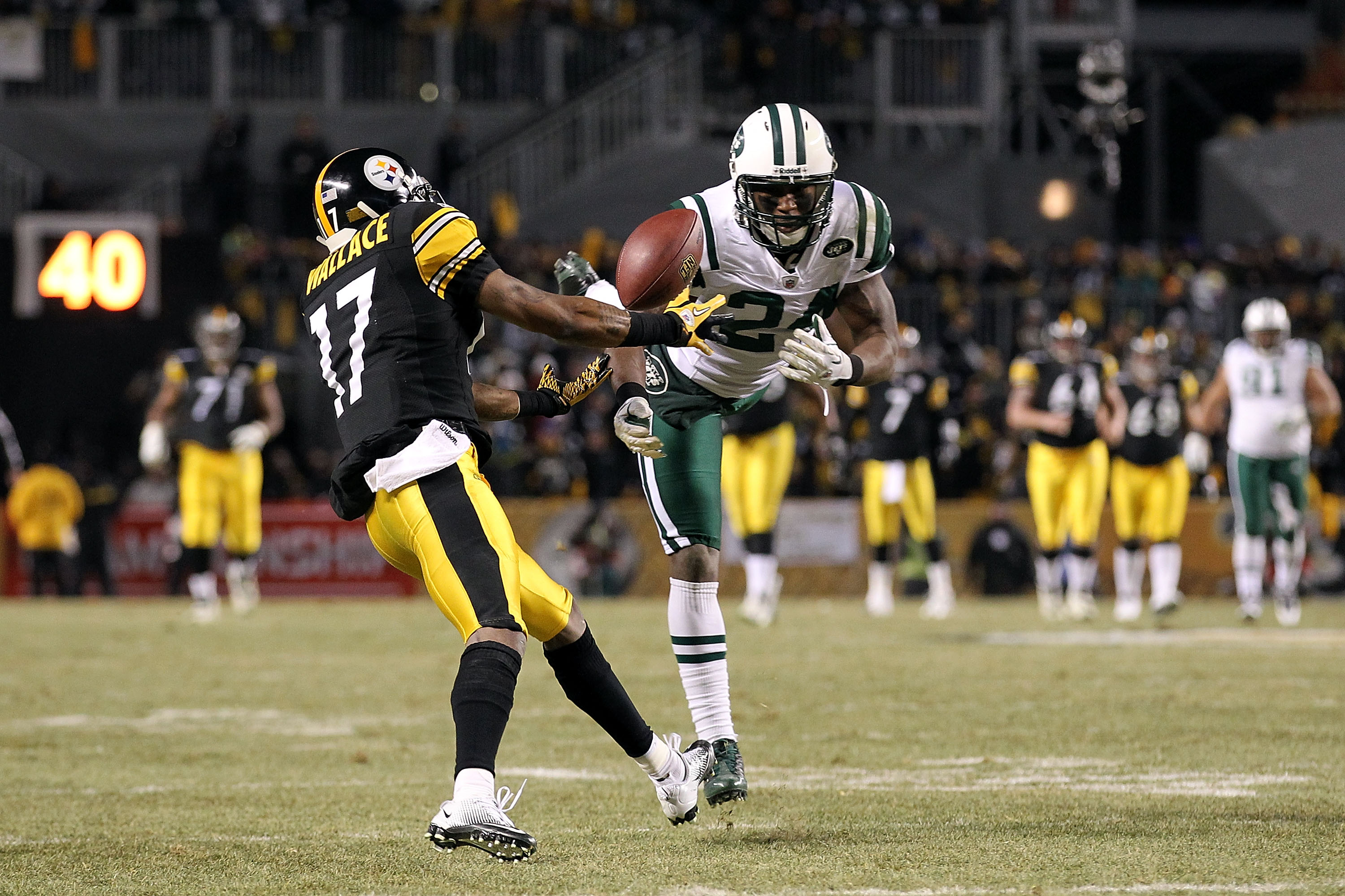 American football defensive backs in pass coverage