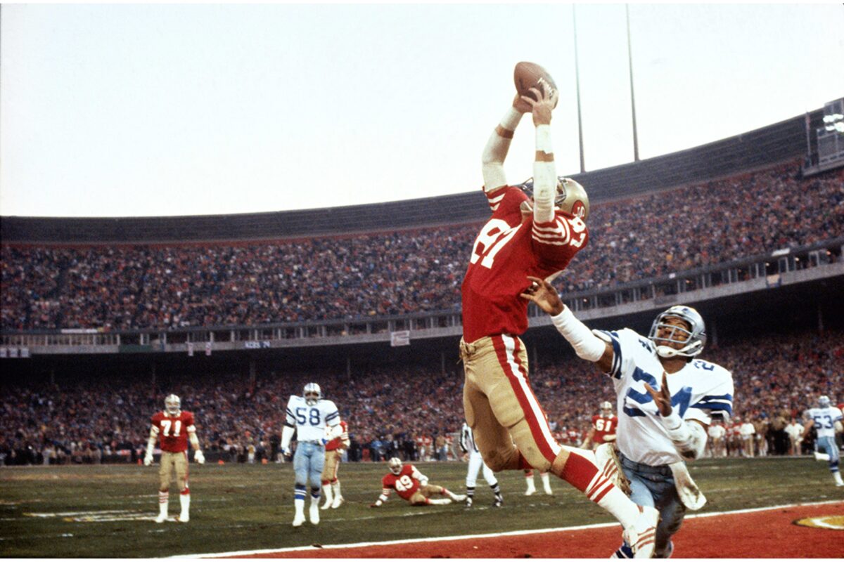 Wide receiver catching a pass during an American football game