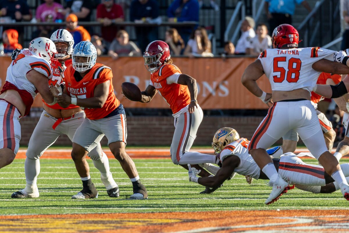Offensive linemen attempting a double team against a crowded defensive front