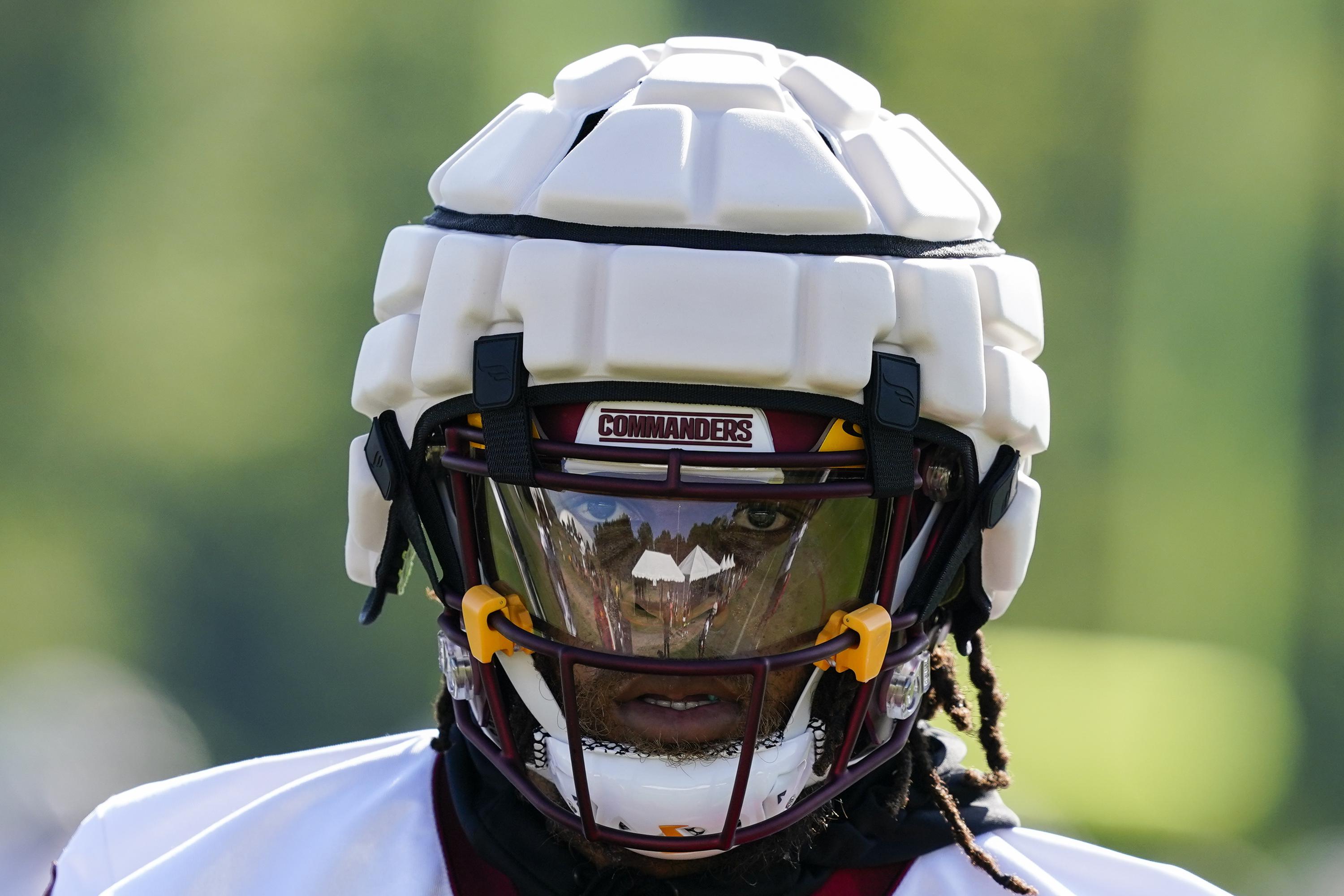 American football safety equipment including helmet and pads