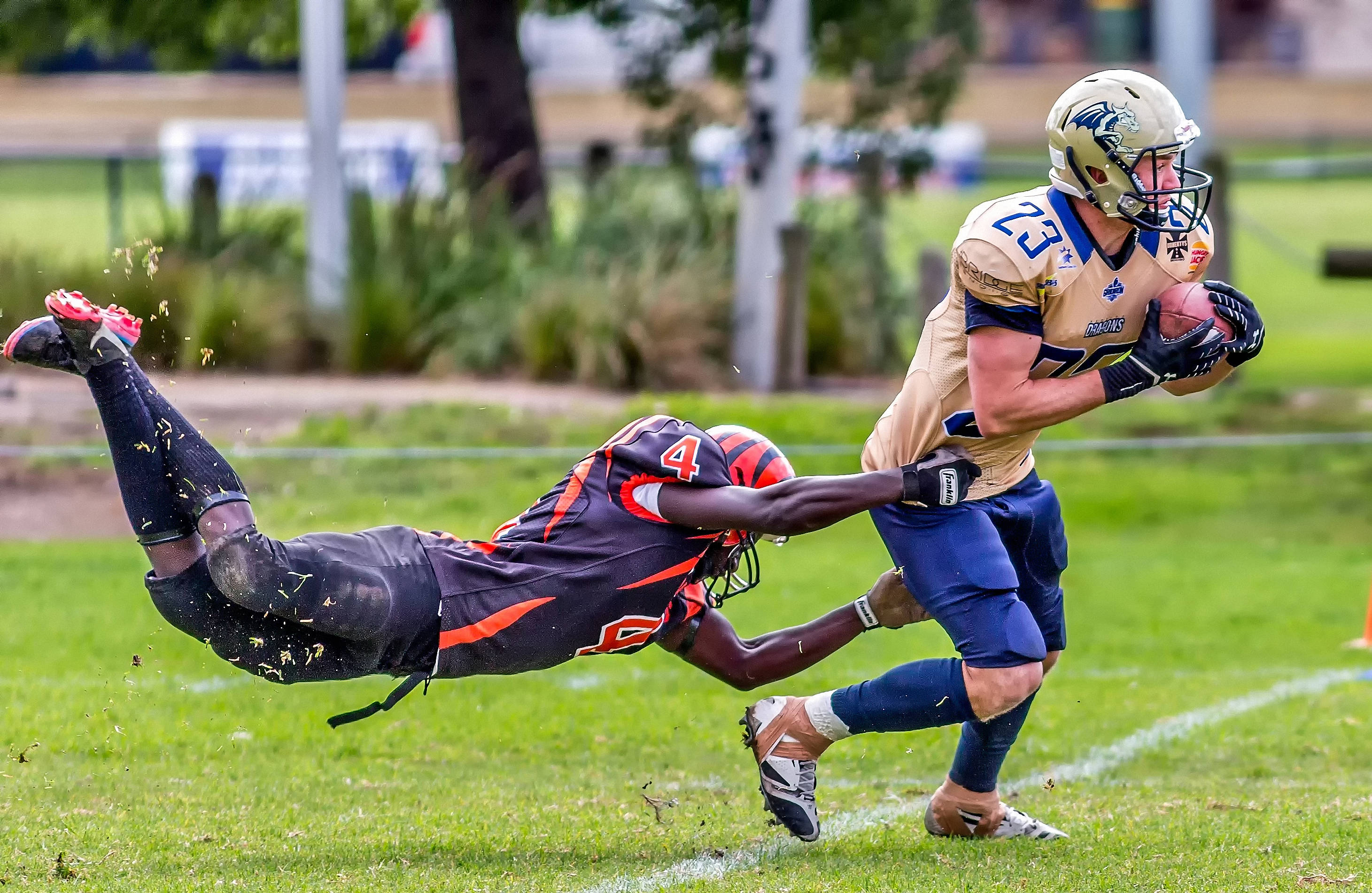 American football defenders making a tackle