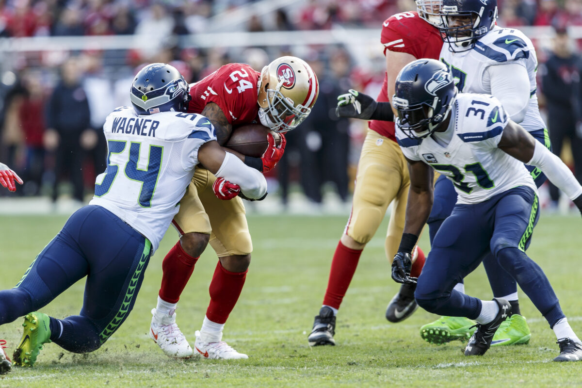 Defensive tackle generating interior pressure against an offensive guard