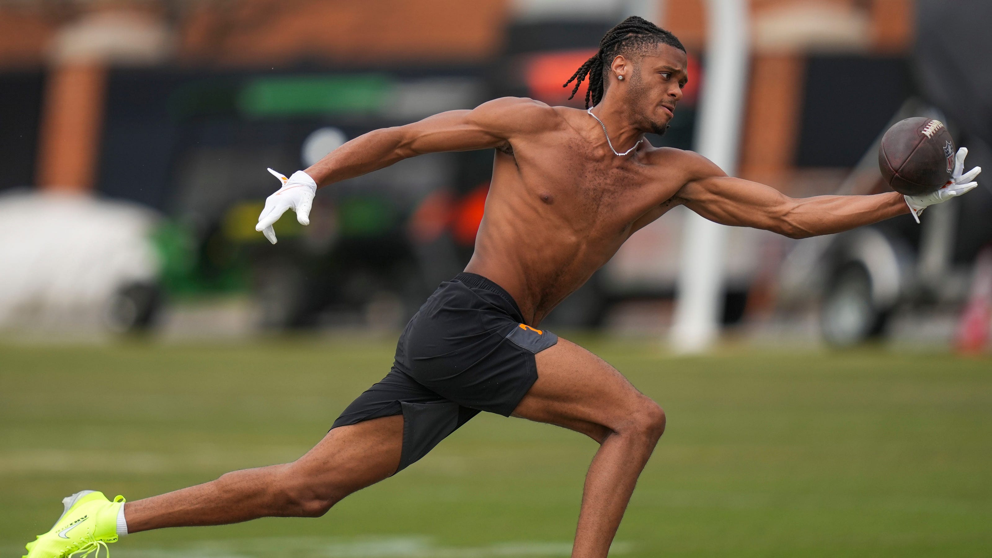 American football rookie practicing in a helmet after being drafted