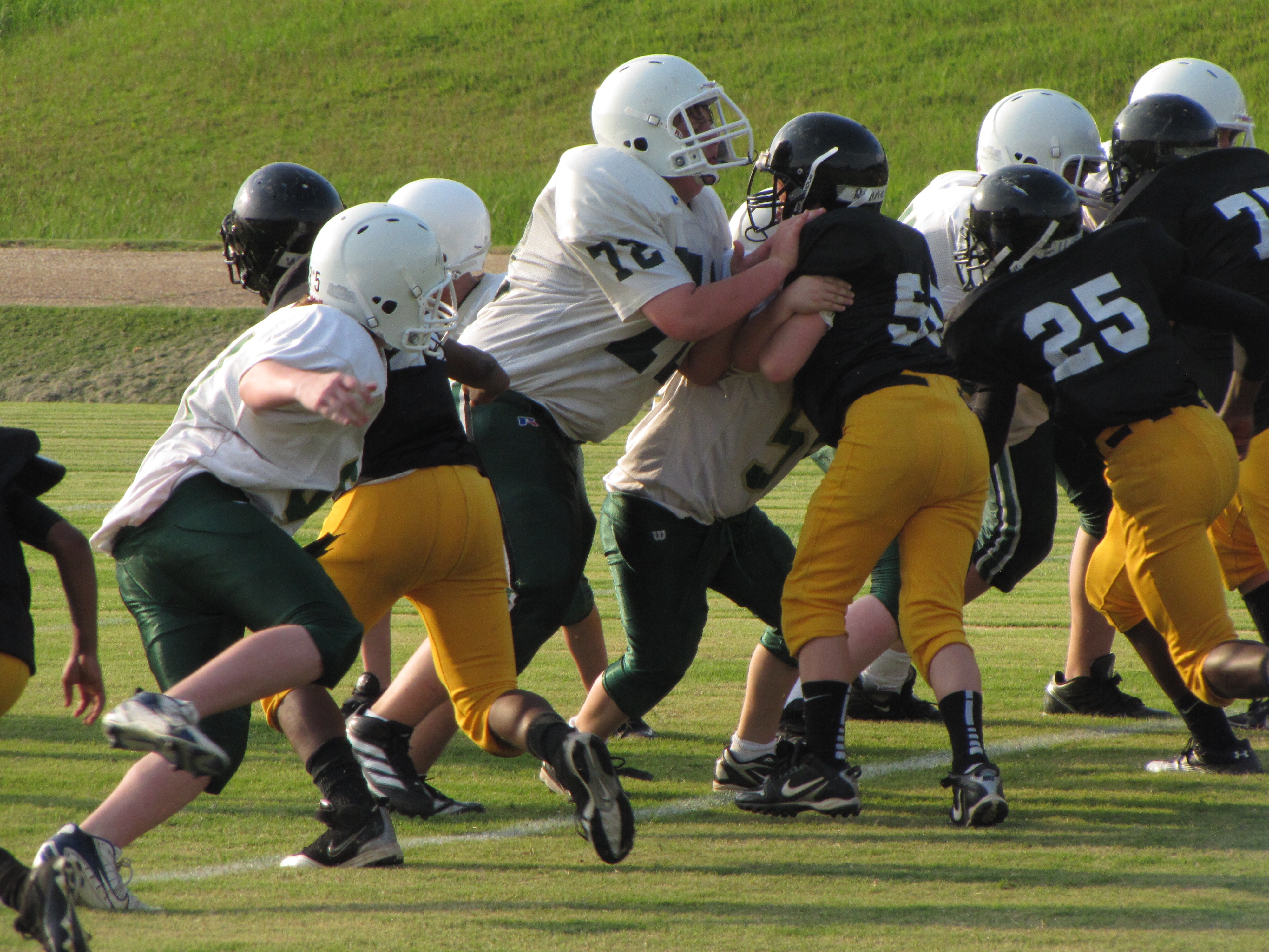 American football offense in formation at the line of scrimmage