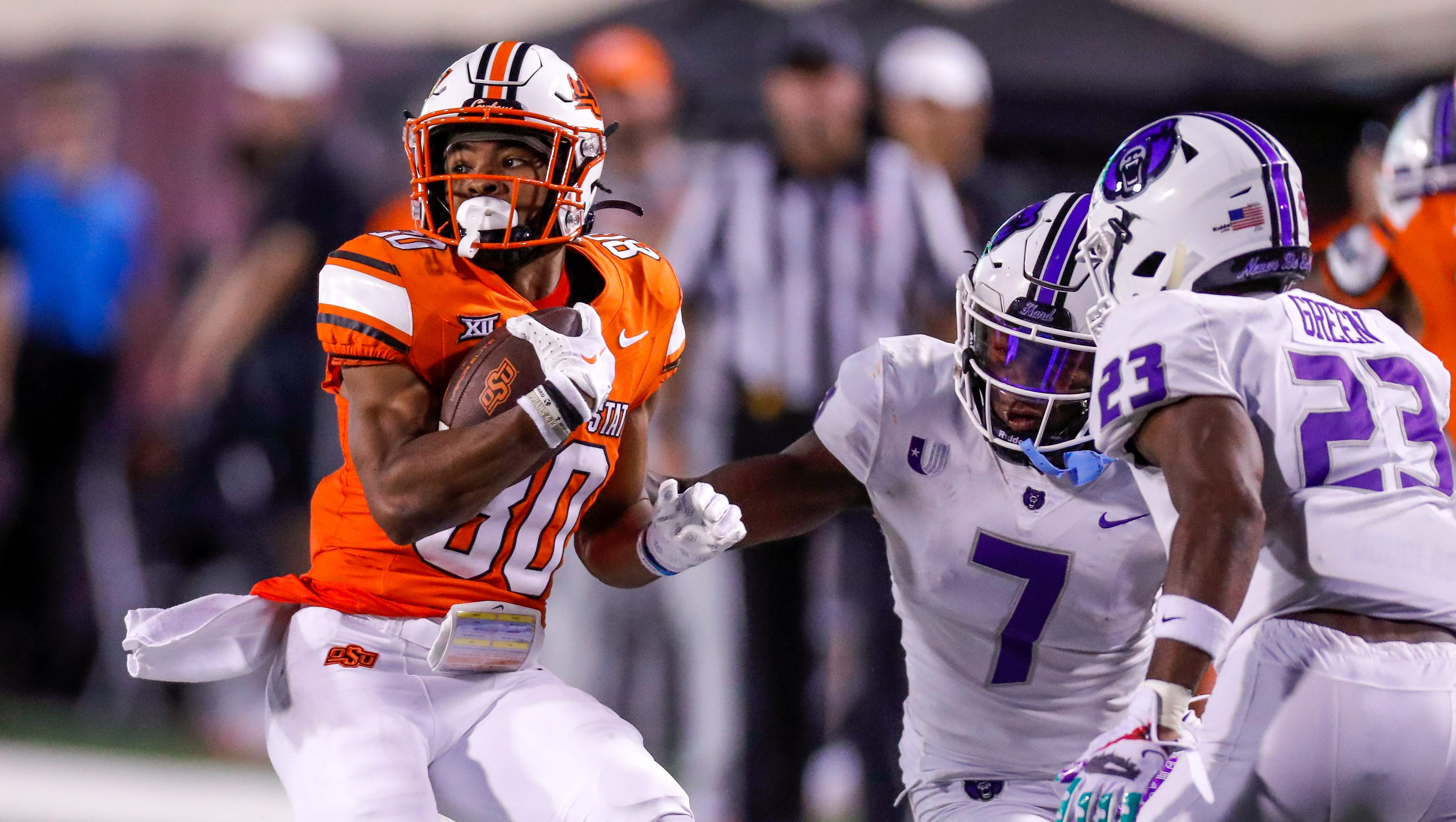 American football receiver moving before the snap
