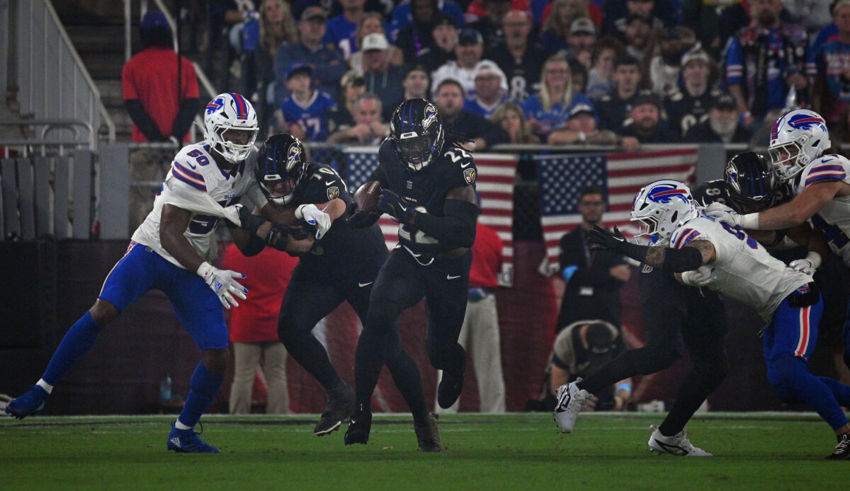 Fullback leading a runner through the line