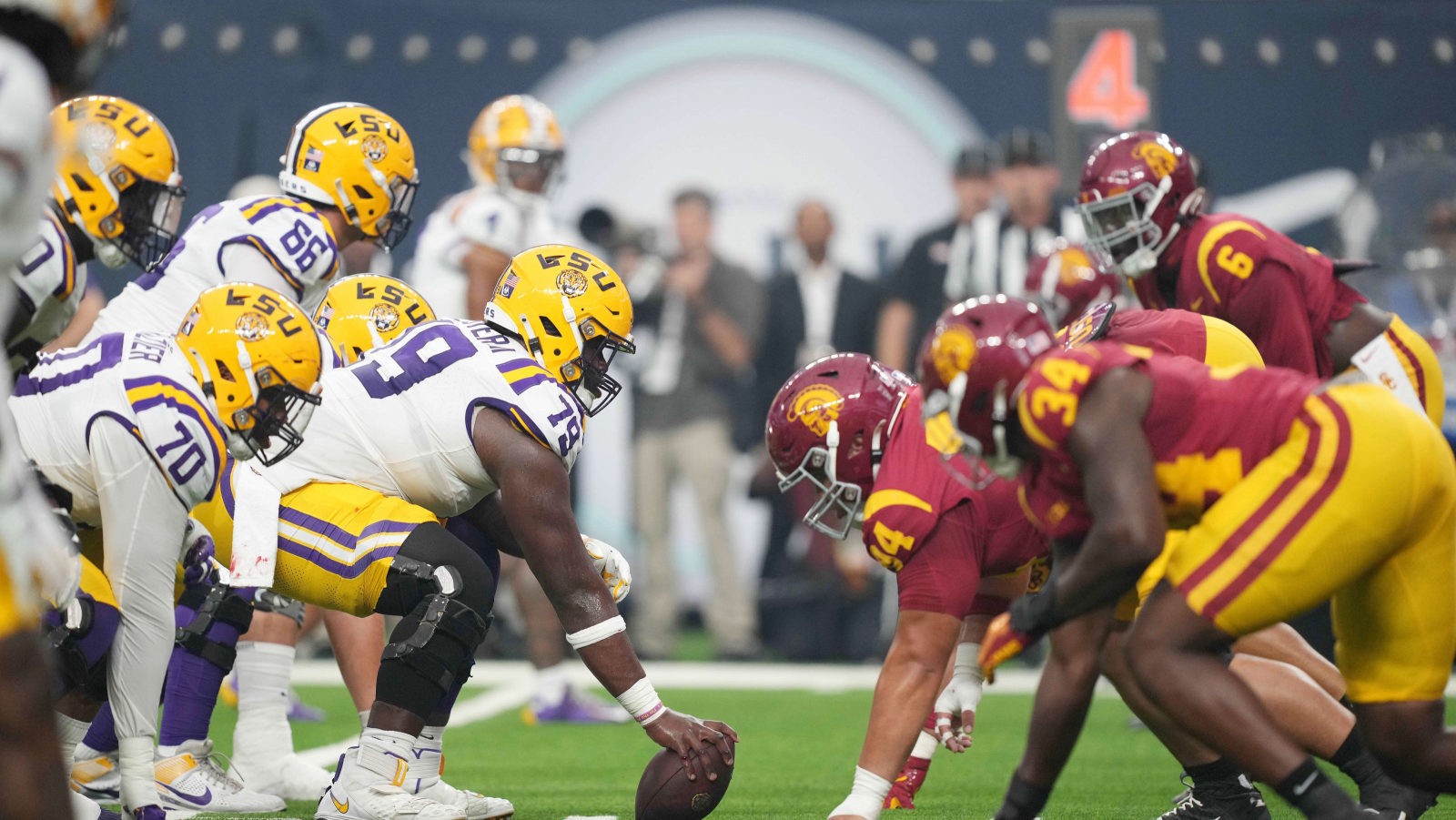 College football players practicing by position group